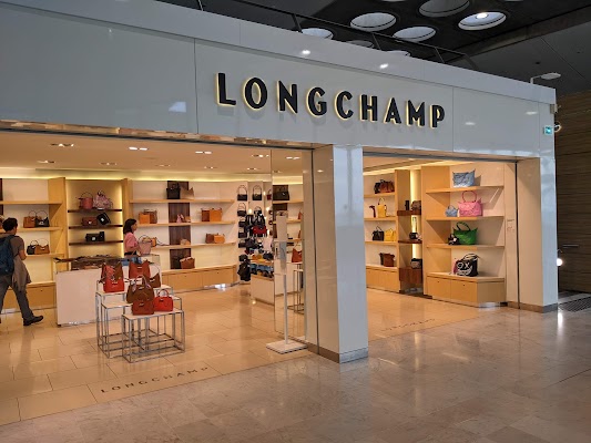 Longchamp Shop at Duty Free Cosmetics Boutiques at the International Airport  at Charles De Gaulle, Paris. Luxury French Brand Editorial Stock Photo -  Image of indoors, airport: 221824703